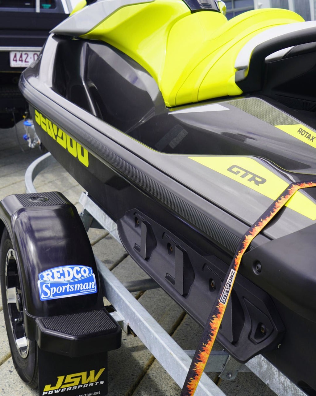 Strap Onz Retractable Flames strap securing a jet ski to its trailer